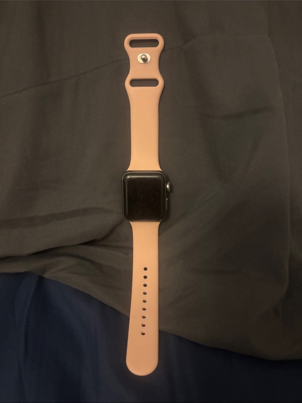 Apple Watch Series 3 with pink silicone band